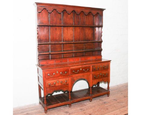 Georgian oak dresser with open shelf back, spice drawers and five drawers under with arched hutch centre and plate rack, 82" 