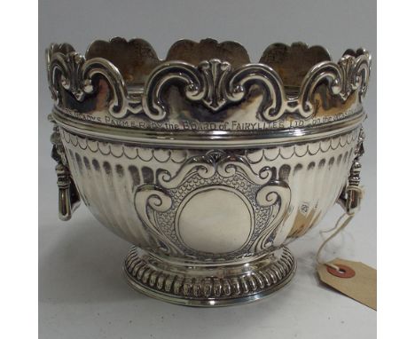 Late Victorian silver presentation posy bowl of monteith form, with half fluted body, shaped 'C' scroll rim, twin lion mask w