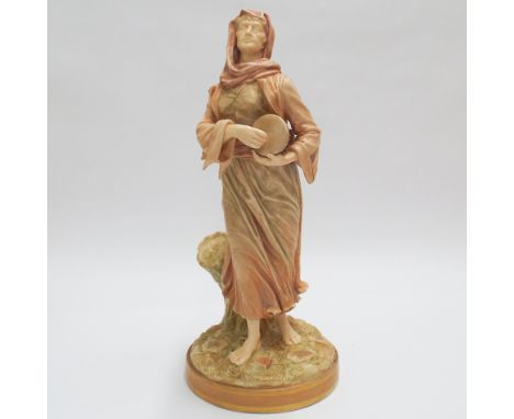 Royal Worcester porcelain figure of a classical  tambour player on a rustic style base. 33 cms high