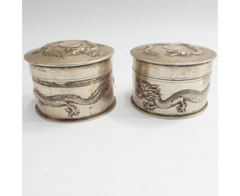 Pair of Chinese silver circular trinket boxes, decorated with coiling dragons and engraved with initials, marked Tuk Chang an