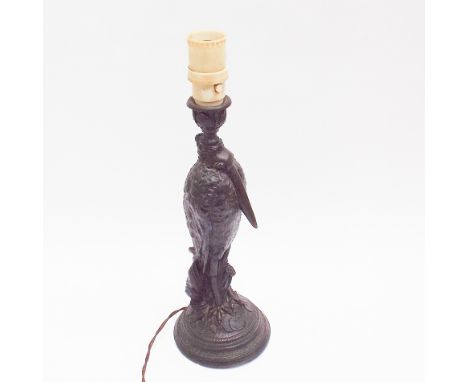 Old spelter table lamp modelled as a heron, 38cm high including bakelite light fitment   There are a couple of cracks to the 