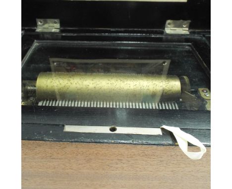 Small Victorian inlaid rosewood musical box, playing 8 airs. 