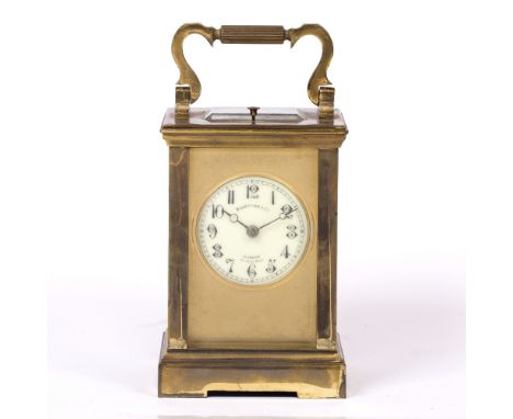 A LATE 19TH CENTURY FRENCH CARRIAGE CLOCK the dial signed Benetfink & Co., London with moon hands and gilt mask, platform lev