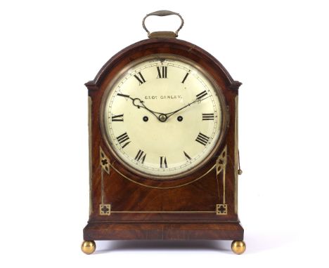 A REGENCY MAHOGANY BRACKET OR TABLE CLOCK the convex Roman dial signed George Carley, strike/silent lever at XII, the twin tr