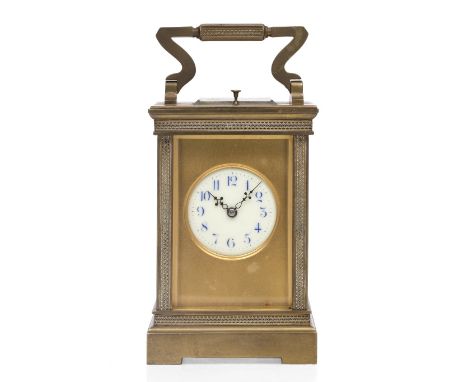 A LATE 19TH CENTURY FRENCH BRASS CASED CARRIAGE CLOCK the disc enamel dial with blue Arabic numerals and satin gilt mask, the