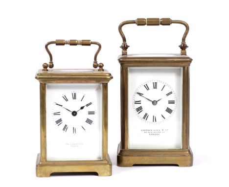 A FRENCH BRASS CARRIAGE TIMEPIECE with engraved case, the dial signed Camerer Kuss & Co. London, 12cm high; and a further bra