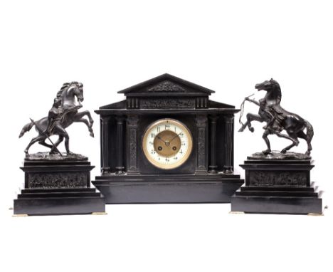 A LATE 19TH CENTURY FRENCH MANTEL CLOCK with two piece dial, Gothic enamel chapter ring and twin train movement with coiled g