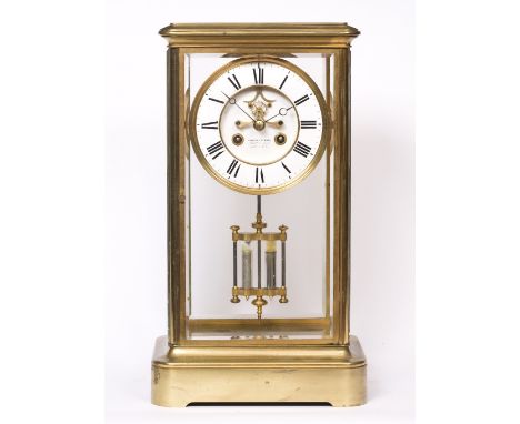 A GIANT 19TH CENTURY FRENCH BRASS FOUR GLASS CLOCK the two piece white enamel dial with Roman numerals, Breguet style hands a