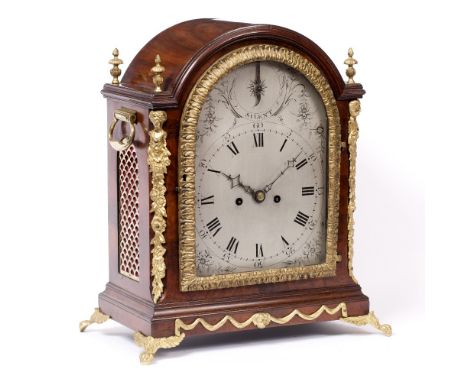 A GEORGE III MAHOGANY BRACKET OR TABLE CLOCK the silvered arch Roman dial with Arabic five minutes, strike/silent dial and fl