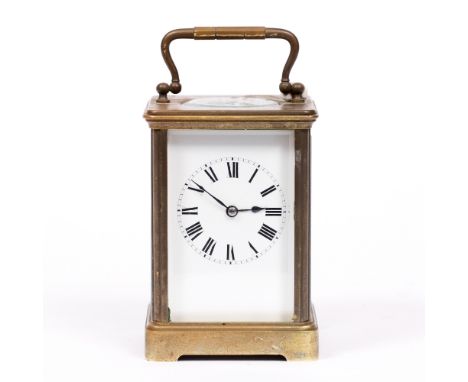 A FRENCH BRASS CARRIAGE TIMEPIECE with white enamel dial and Roman numerals, 11cm high