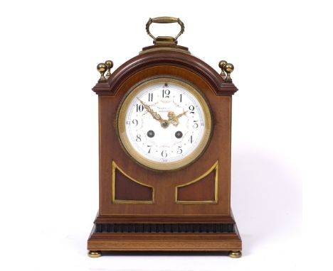 AN EDWARDIAN MAHOGANY MANTEL CLOCK the white enamel convex Arabic dial with floral swags, signed Terry & Co. Manchester, with