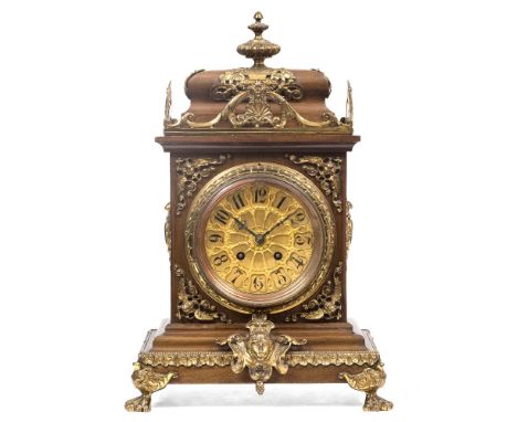 A LATE 19TH CENTURY FRENCH MAHOGANY MANTEL CLOCK with gilt overlaid Arabic dial, twin train movement, striking on a coiled go