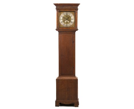 ADAM CLEAK, BRIDPORT An oak eight day longcase clock, the 12" square brass dial with silvered Roman chapter ring, Arabic five