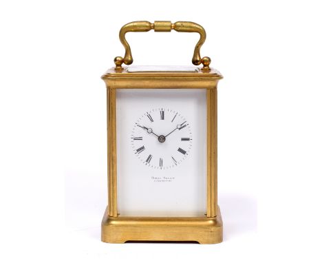 A 19TH CENTURY FRENCH CARRIAGE CLOCK the white enamel Roman dial signed Harry Bright, Leamington, the twin train movement wit