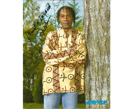 Joe Morton signed 10x8 colour photo, 3/4 length portrait leaning on tree. Good Condition. All autographs are genuine hand sig