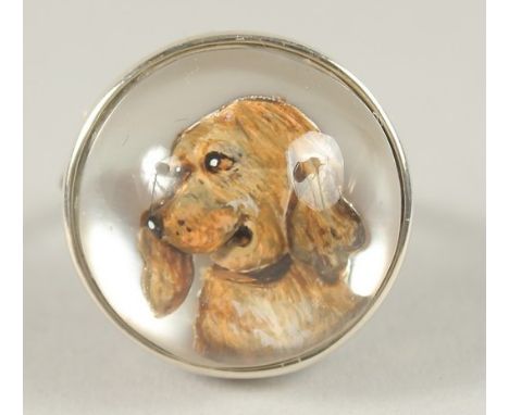 A SILVER ESSEX CRYSTAL DOG RING.