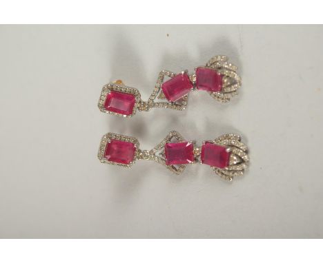 A GOOD SILVER SET GOLD, EMERALD, DIAMOND AND RUBY EARRINGS.