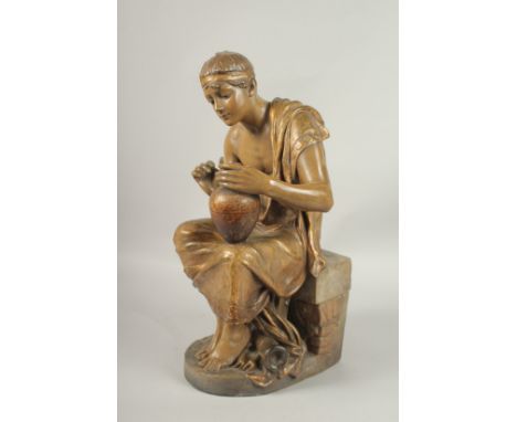 A GOLDSCHEIDER SIGNED POTTERY FIGURE OF A SEATED YOUNG ROMAN holding a pitcher. 50cms high.