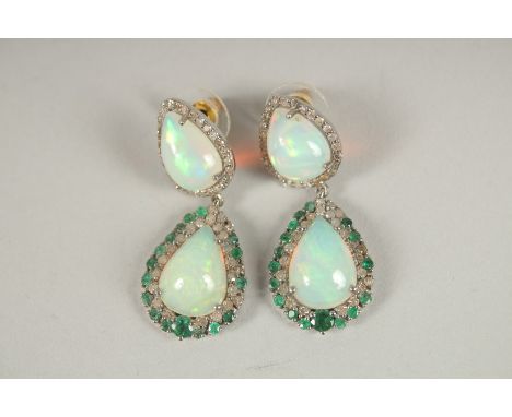 A SILVER AND GOLD PAIR OF OPAL, EMERALD AND DIAMOND DROP EARRINGS.