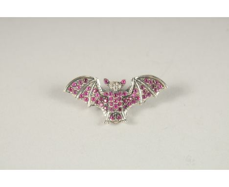 A SILVER RUBY SET, DIAMOND EYE BAT BROOCH AND PENDANT.