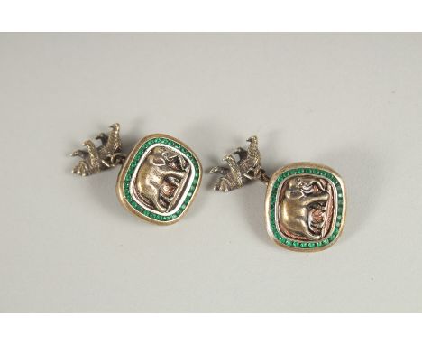 A PAIR OF RUSSIAN SILVER AND EMERALD ELEPHANT CUFFLINKS. Mark Head 88, Faberge.  Weight 26gms.