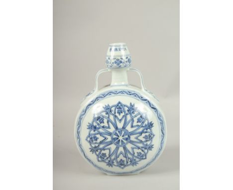 A CHINESE BLUE AND WHITE TWIN-HANDLE MOON FLASK. 31cms high.