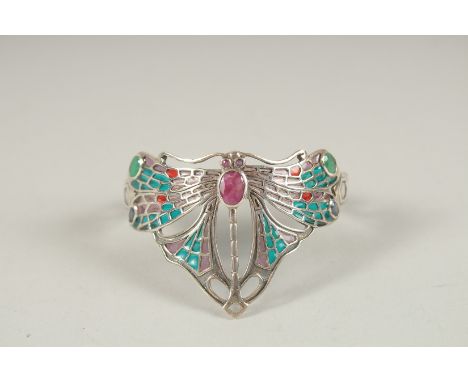 A SILVER RUBY, EMERALD AND SAPPHIRE DRAGONFLY BANGLE.