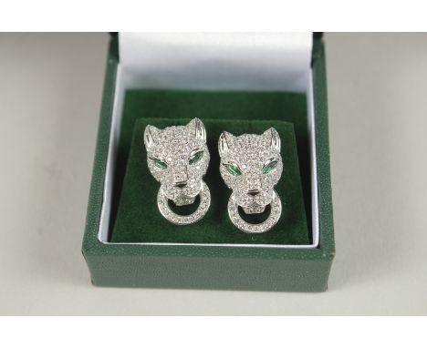 A PAIR OF SILVER PANTHER HEAD EAR STUDS.