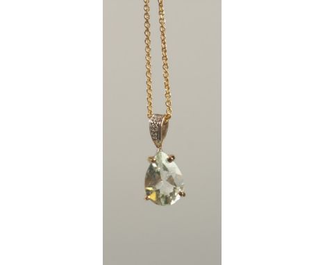 A 9CT YELLOW GOLD PENDANT set with pear shaped green amethyst and a diamond set bale on a gold-plated silver chain, boxed. Am