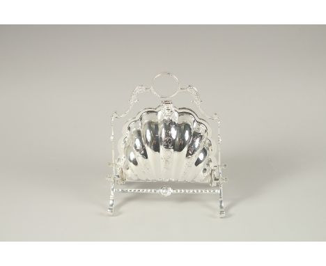 A SILVER PLATED SHELL SHAPED BISCUIT AND CHEESE STAND.