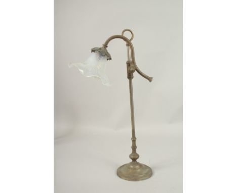 AN EDWARDIAN METAL LAMP with vaseline glass shade. 50cms high