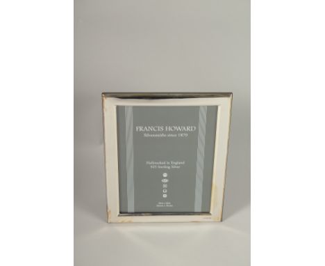 A HALLMARKED STERLING SILVER PHOTOGRAPH FRAME. 20cms x 15cms.
