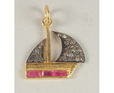 A GOLD AND ENAMEL BOAT CHARM.