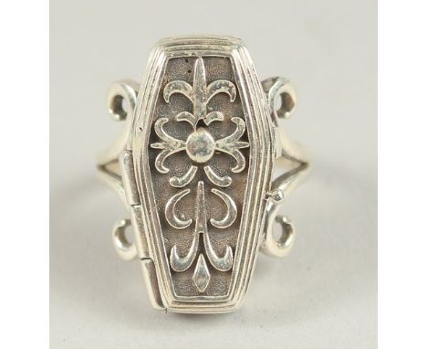 A SILVER COFFIN RING.