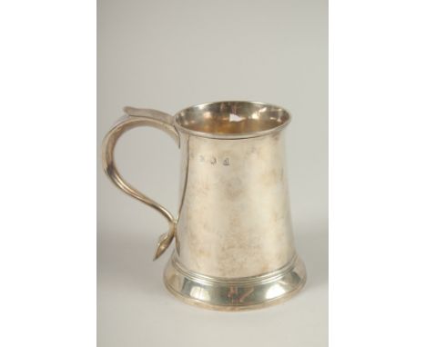 A GEORGE III SILVER PINT TANKARD with scroll handle. London 1779. Maker: W. G. Weight: 11ozs.