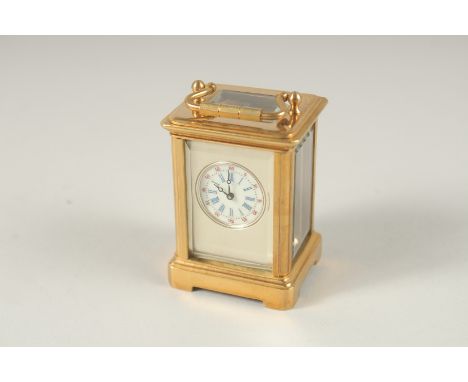 A MINI BASS CARRIAGE CLOCK. 6cms high.