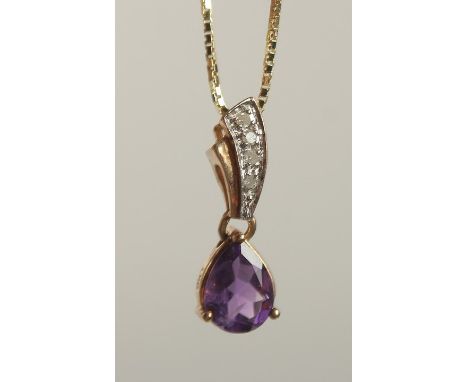 A 9CT YELLOW GOLD PEAR SHAPED AMETHYST PENDANT with diamond set bale on a gold-plated silver chain, boxed. Amethyst 1.00ct ap