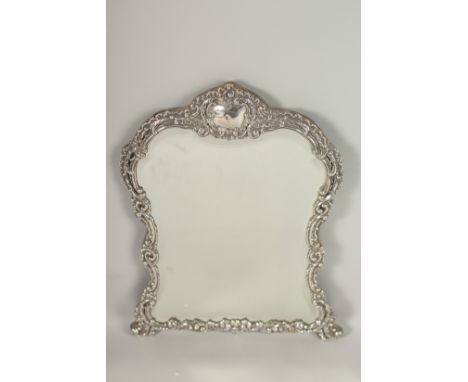 A SILVER DRESSING TABLE MIRROR with scroll decoration. 43cms high.