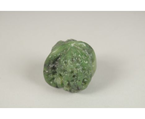 A CARVED JADE WALNUT.