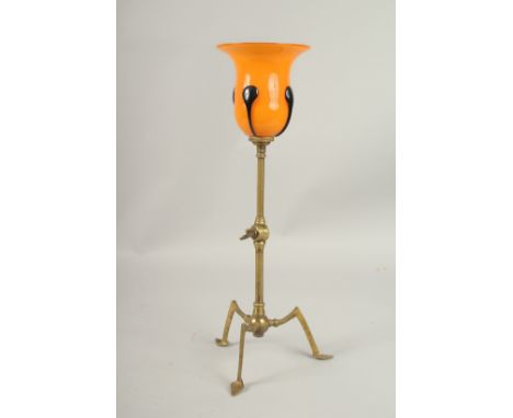 AN AESTHETIC MOVEMENT BENSON TYPE BRASS LAMP WITH LOETZ SHADE. 36cms high.