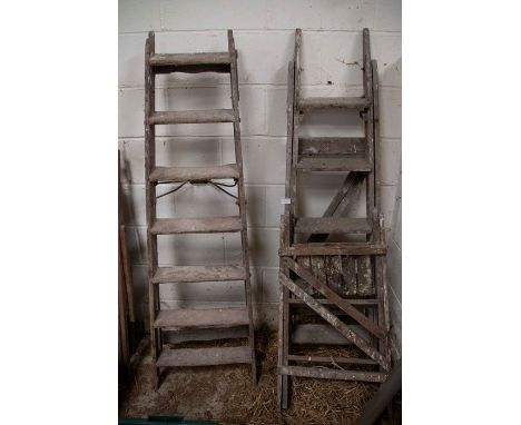 Three vintage step ladders for decorative or display use.