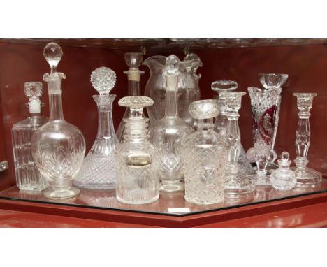 Shelf of various glass decanters