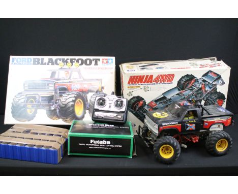 Two boxed 1/10 scale Tamiya models to include Ford F-150 Ranger Blackfoot (Without car body) and The Ninja 4WD car, both buil