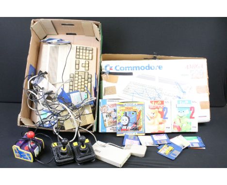 Retro Gaming - Boxed Amiga Commodore 500 gaming console and unboxed Amiga Commodore 500 console together with a collection of