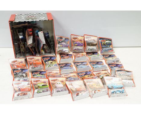 57 Carded Mattel Disney Pixar Cars diecast models, all ex, contained within a Cars storage box 
