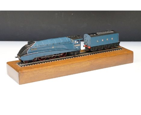 Bachmann OO gauge Mallard locomotive with tender along with a straight of track on wooden plinth for display 