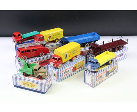 Eight boxed Dinky diecast models to include 430 Breakdown Lorry beige cab and chassis, green crane and red hubs, 922 Big Bedf