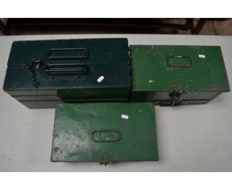 Two vintage top opening metal tool chests containing a quantity of painting and decorating tools, paintbrushes, plastering tr