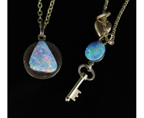 Two yellow metal and opal pendants, one doublet cut opal with Ram design to the reverse with clasp marked 375, other doublet 