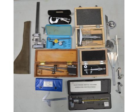Collection of precision measuring tools including an imperial height gauge by NSF (England), digital Vernier callipers, metri